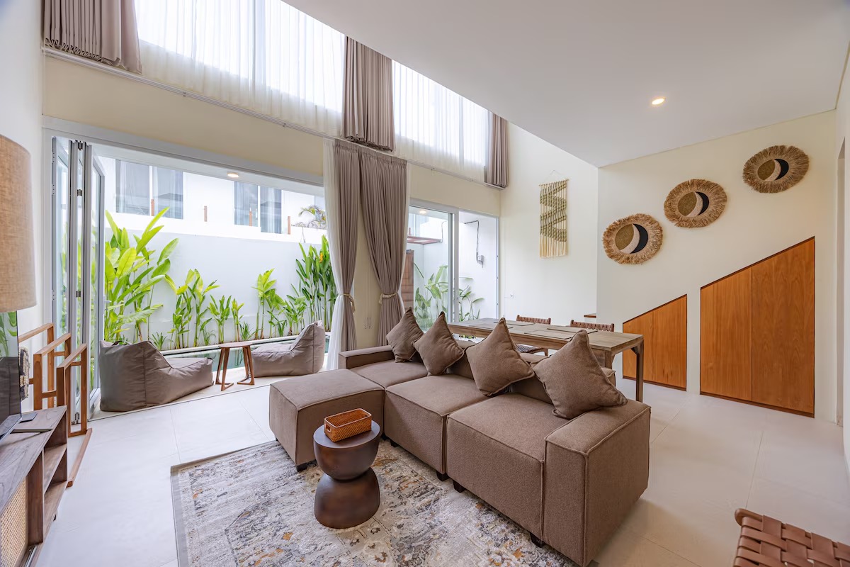 Living room with sectional sofa opening onto the garden