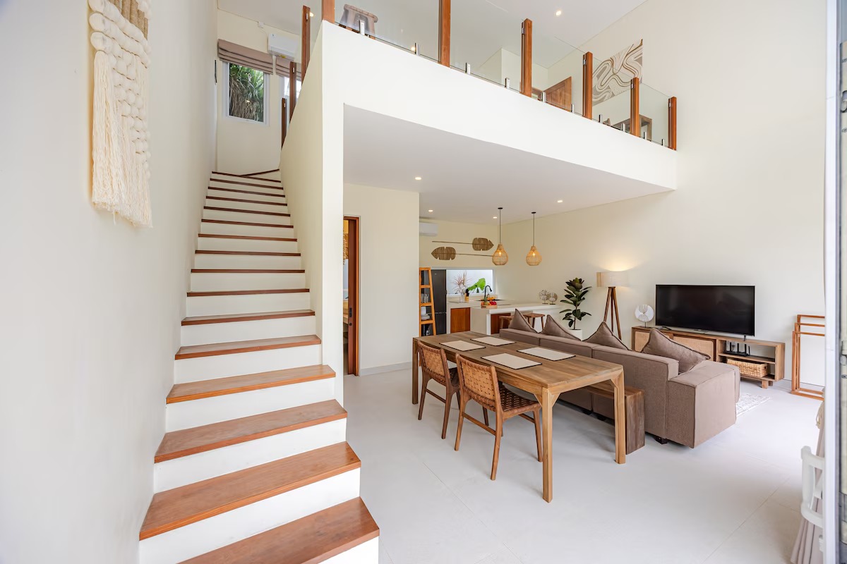 Staircase leading to the mezzanine above the living room